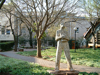 Pioneer sculpture outside School of Law