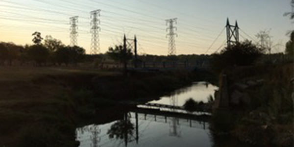 Power lines over river credit David Francis