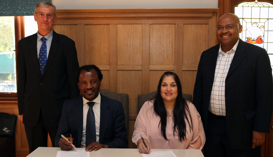Professor Zeblon Vilakazi, Deputy Vice Chancellor at Wits University, sits together with Raakshani Sing, Executive Manager at CHIETA during the signing ceremony of Africas first Energy Leadership Centre (ELC), officially launched at the Wits Business School. They are flanked by Dr Rod Crompton, newly-appointed Director of the ELC (on the left) and Maurice Radebe, Deputy Vice President: Energy and