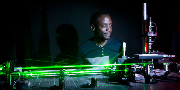 PhD student Nkosi Bhebhe works on an experiment in the Structured Light Laboratory at Wits University: Credit: Wits University. 